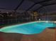 Inviting pool illuminated at night, creating a relaxing ambiance for evening enjoyment at 781 Binnacle Point Dr, Longboat Key, FL 34228