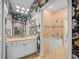 Stylish bathroom featuring floral wallpaper, granite counter, and a tiled shower-tub combo at 876 Ranch Rd, Tarpon Springs, FL 34688