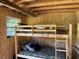 Cozy bedroom features built-in wooden bunk beds, perfect for maximizing space and comfort at 876 Ranch Rd, Tarpon Springs, FL 34688