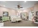 Bright bedroom featuring elegant white furnishings, soft pink walls, and sophisticated decor at 876 Ranch Rd, Tarpon Springs, FL 34688