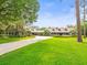 Charming one-story home with a large front yard, covered front porch and ample parking at 876 Ranch Rd, Tarpon Springs, FL 34688