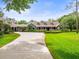 Charming one-story home with a large front yard, covered front porch and ample parking at 876 Ranch Rd, Tarpon Springs, FL 34688
