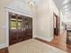 Grand foyer entrance featuring double doors, hardwood floors, and a view into the home at 876 Ranch Rd, Tarpon Springs, FL 34688