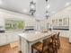Well-lit kitchen with white cabinets, a large island, and stainless steel appliances at 876 Ranch Rd, Tarpon Springs, FL 34688