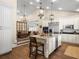 Open kitchen with a center island, stainless steel appliances, and an easy flow to other living spaces at 876 Ranch Rd, Tarpon Springs, FL 34688
