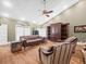 Inviting living room with high ceilings, leather furniture, and hardwood flooring at 876 Ranch Rd, Tarpon Springs, FL 34688