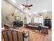 Spacious Living Room with high ceiling, ceiling fan, and leather furniture at 876 Ranch Rd, Tarpon Springs, FL 34688