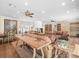 Open-concept living room featuring built-in bookcases and stylish furniture arrangement at 876 Ranch Rd, Tarpon Springs, FL 34688