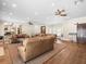 Open floor plan with multiple seating areas and hardwood floors at 876 Ranch Rd, Tarpon Springs, FL 34688