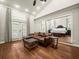 A view from main bedroom of a seating area, wooden floors, and vaulted ceilings at 876 Ranch Rd, Tarpon Springs, FL 34688