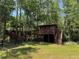 Backyard treehouse with stairs and elevated platforms at 876 Ranch Rd, Tarpon Springs, FL 34688