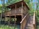 Elevated wooden treehouse with stairs and a small balcony at 876 Ranch Rd, Tarpon Springs, FL 34688