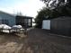 A backyard features a shed, trailer, and privacy fence near waterfront home at 8822 Rocky Creek Dr, Tampa, FL 33615