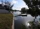 Dock and waterfront view from the property, showcasing the property's access to the water and serene setting at 8822 Rocky Creek Dr, Tampa, FL 33615