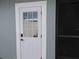Exterior door to the home features a keypad and privacy window at 8822 Rocky Creek Dr, Tampa, FL 33615