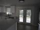 Bright kitchen featuring white cabinets, light countertops, and sliding glass doors at 8822 Rocky Creek Dr, Tampa, FL 33615