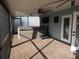 Relaxing covered patio with a hot tub and a ceiling fan at 8822 Rocky Creek Dr, Tampa, FL 33615