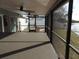 Enjoy the screened-in patio with its fan and beautiful view of the waterfront at 8822 Rocky Creek Dr, Tampa, FL 33615