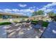 Backyard with a patio, a lawn, and an outdoor dining and lounge space for relaxing at 9948 51St N Ave, St Petersburg, FL 33708