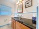 This bathroom offers a sink, vanity, and toilet for everyday convenience at 9948 51St N Ave, St Petersburg, FL 33708