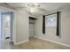 Cozy bedroom with speckled floors, a functional closet, and a ceiling fan for comfortable living at 10275 117Th Dr, Largo, FL 33773