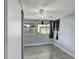 Bedroom featuring a window with curtains, a ceiling fan, and closet space at 10275 117Th Dr, Largo, FL 33773