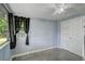 Cozy bedroom featuring a window with curtains, closet, and light walls at 10275 117Th Dr, Largo, FL 33773