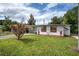 Charming single-story home featuring a covered carport and well-maintained lawn in a residential neighborhood at 10275 117Th Dr, Largo, FL 33773
