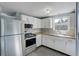Well-equipped kitchen featuring wood countertops, stainless steel appliances, and ample cabinet space at 10275 117Th Dr, Largo, FL 33773