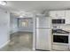 Bright kitchen with stainless steel appliances overlooking the living space and plenty of natural light at 10275 117Th Dr, Largo, FL 33773