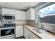 Bright kitchen featuring stainless steel appliances and wood countertops at 10275 117Th Dr, Largo, FL 33773