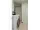 Efficient laundry room featuring modern front-load machines and ample storage cabinets at 10275 117Th Dr, Largo, FL 33773