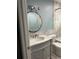 Well lit bathroom featuring a stylish vanity and bathtub with shower at 11096 117Th Way, Seminole, FL 33778