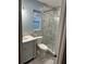 Updated bathroom features marble-tiled shower with glass door and a modern vanity sink at 11096 117Th Way, Seminole, FL 33778