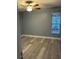 Bedroom featuring hardwood floors, ceiling fan and window with blinds at 11096 117Th Way, Seminole, FL 33778