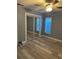 Bedroom featuring hardwood floors and a large closet with sliding doors at 11096 117Th Way, Seminole, FL 33778