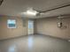 Spacious garage with epoxy flooring, automatic door opener, and utility connections at 11096 117Th Way, Seminole, FL 33778