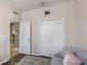 Light and airy bedroom showing a love seat, closet, and doorway to another room at 11142 Spring Point Cir, Riverview, FL 33579