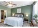 A lovely bedroom with a queen bed, decorative wall art, and modern nightstands with lamps at 11142 Spring Point Cir, Riverview, FL 33579