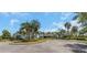 Landscaped community entrance with palm trees and well-maintained greenery at 11142 Spring Point Cir, Riverview, FL 33579