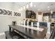 Spacious dining area featuring elegant lighting, decorative accents, and a dark wood dining table at 11142 Spring Point Cir, Riverview, FL 33579