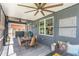 Comfortable seating and dining area under a shady screened in patio at 11142 Spring Point Cir, Riverview, FL 33579
