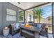 Comfortable outdoor seating area with modern furniture and accent pillows at 11142 Spring Point Cir, Riverview, FL 33579