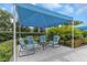 Charming covered patio with cozy seating area, creating a perfect spot for outdoor gatherings at 11142 Spring Point Cir, Riverview, FL 33579