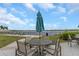 Outdoor patio seating area with stunning lake views, creating a serene ambiance for residents at 11142 Spring Point Cir, Riverview, FL 33579