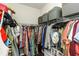 Spacious walk-in closet featuring ample hanging space, shelving, and organizational units at 11142 Spring Point Cir, Riverview, FL 33579