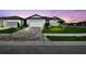 Charming single-Gathering home with a well-manicured lawn and beautiful brick driveway at 11447 Shoreline Trl, Parrish, FL 34219