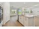 Bright, open kitchen featuring stainless appliances, ample countertops, and access to the backyard at 11447 Shoreline Trl, Parrish, FL 34219