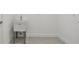 Laundry room with a utility sink and clean, minimalist design at 11447 Shoreline Trl, Parrish, FL 34219
