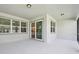 Covered patio featuring views and sliding glass doors for indoor-outdoor living at 11447 Shoreline Trl, Parrish, FL 34219